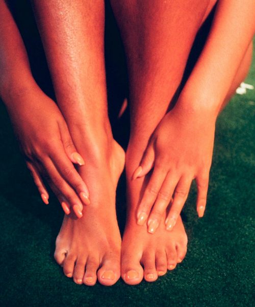 person's feet and hands