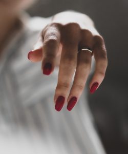 person wearing silver ring on left ring finger